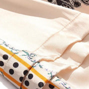 Seda | Satinbluse mit Spitzendetails und Blumenmuster