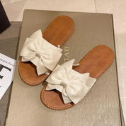 Kehlani l Sommerflache Strandsandalen mit Schleife und Knoten