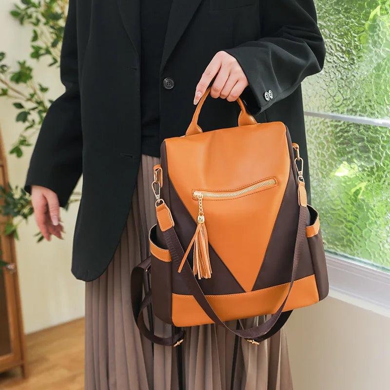 Zahra l Rucksack in Zwei-Farben-Optik mit Quastenanhänger